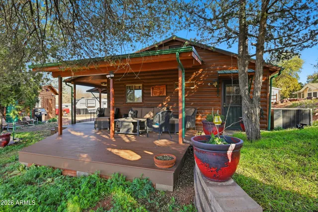 a view of a patio with table and chairs and potted plants