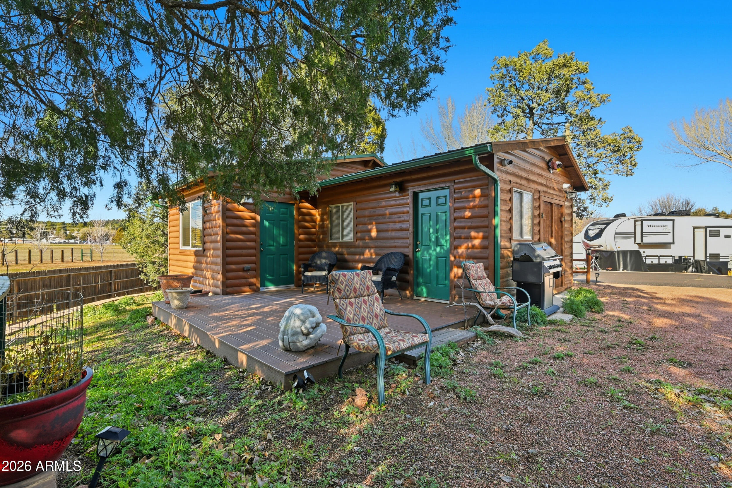 3933 Highway 260, Unit SP 256 Star Valley, AZ 85541 - Photo 2 of 28 a view of a chair and table in backyard