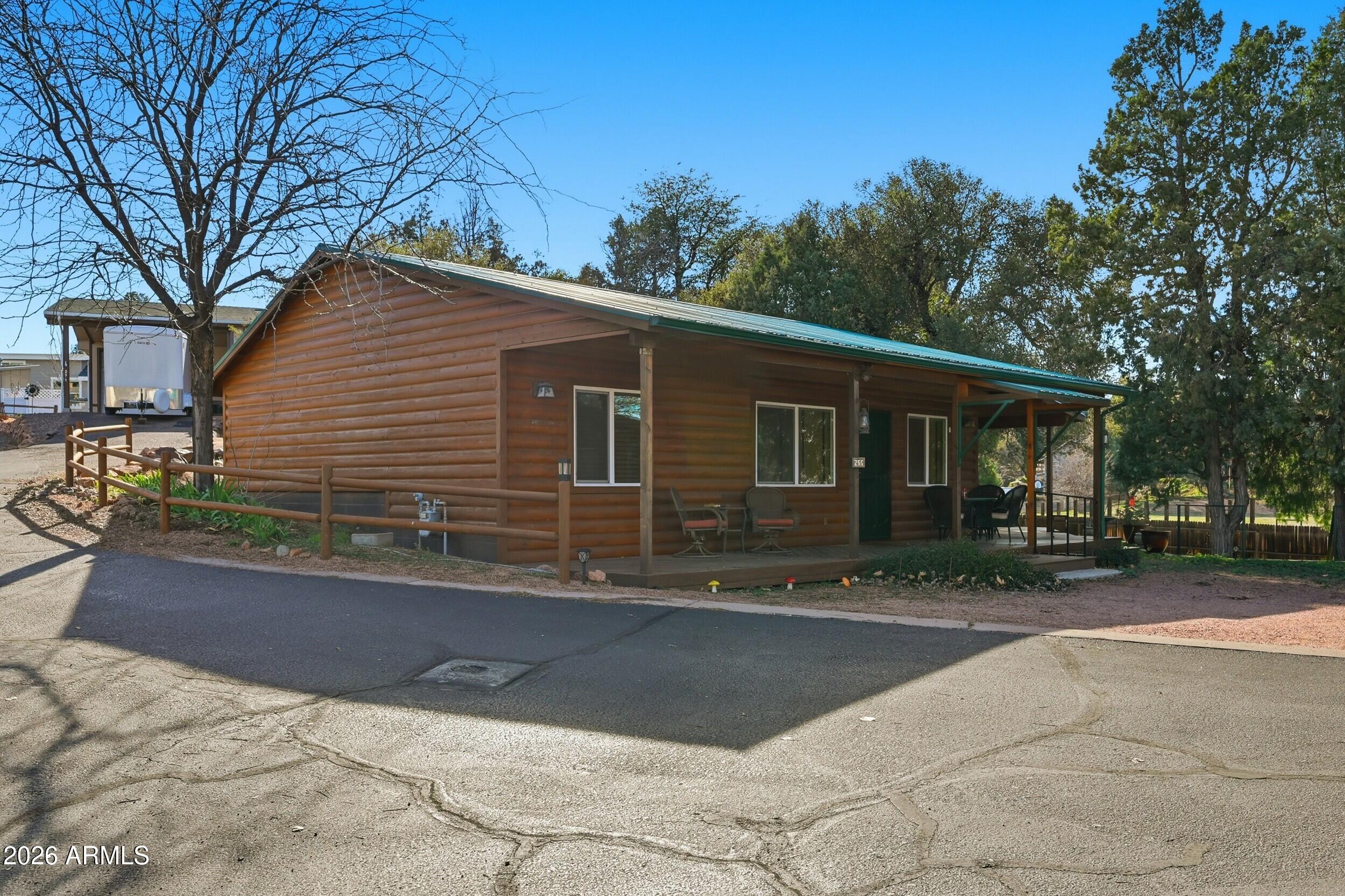 3933 Highway 260, Unit SP 256 Star Valley, AZ 85541 - Photo 24 of 28 a view of a house with a patio