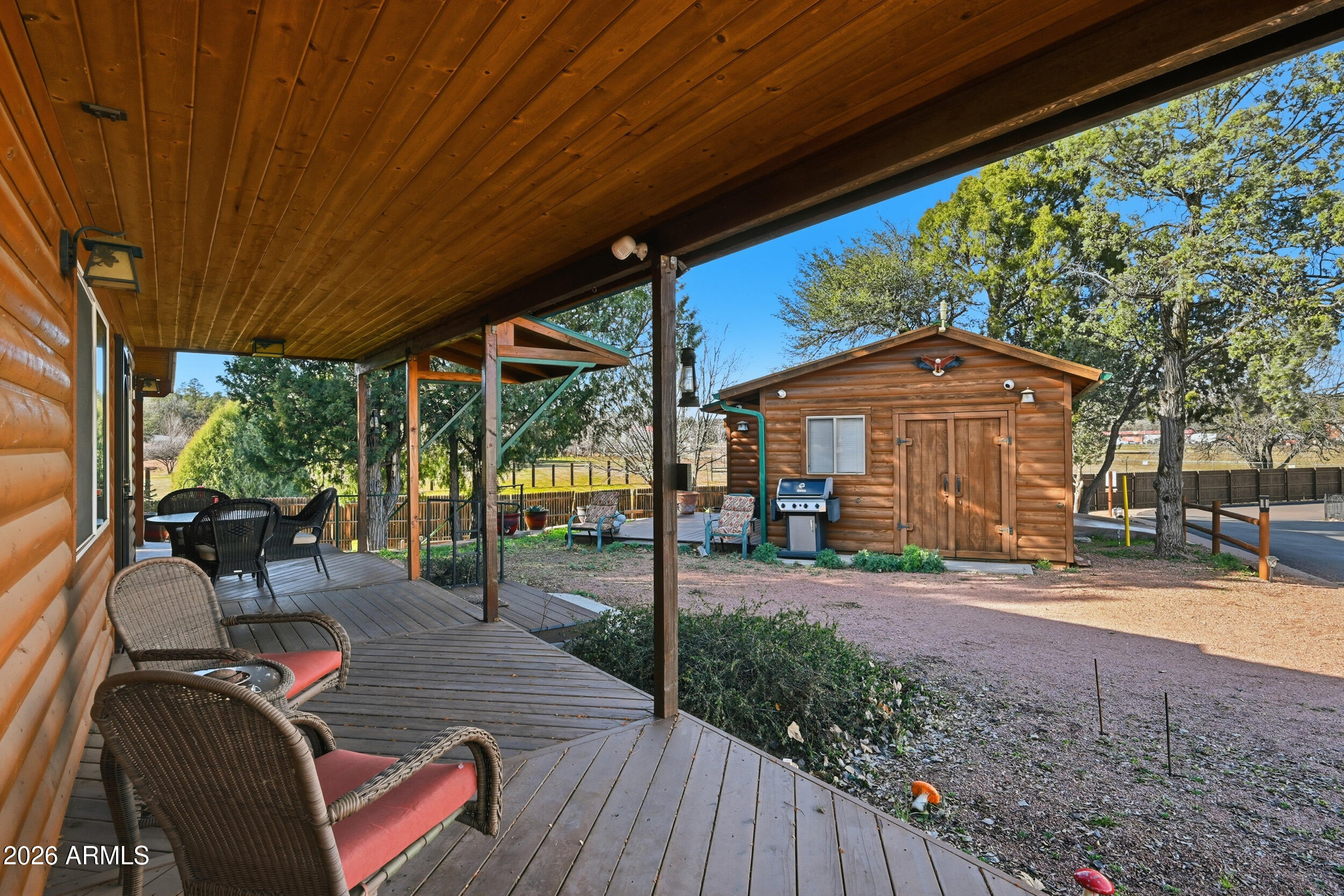 3933 Highway 260, Unit SP 256 Star Valley, AZ 85541 - Photo 3 of 28 a view of a patio with table and chairs under an umbrella
