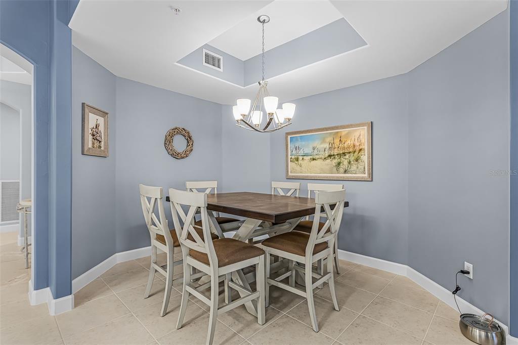3312 Sunset Key Circle, Unit B Punta Gorda, FL 33955 - Photo 11 of 37 a view of a dining room with furniture and a chandelier