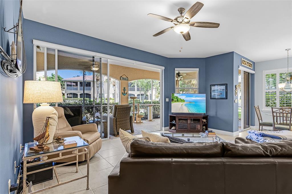 3312 Sunset Key Circle, Unit B Punta Gorda, FL 33955 - Photo 12 of 37 a living room with furniture and a large window