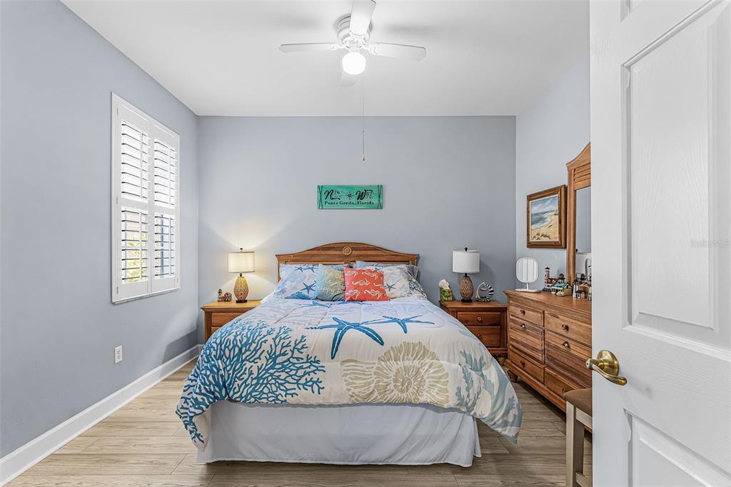 3312 Sunset Key Circle, Unit B Punta Gorda, FL 33955 - Photo 14 of 37 a bedroom with a bed and window