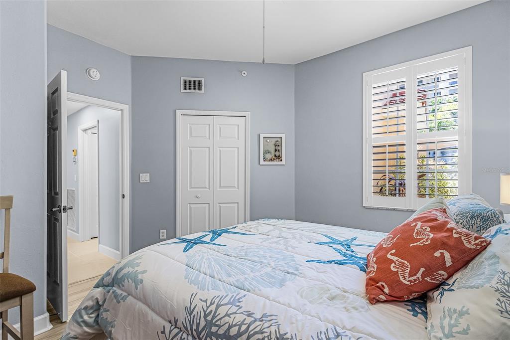 3312 Sunset Key Circle, Unit B Punta Gorda, FL 33955 - Photo 16 of 37 a bedroom with a bed and a window