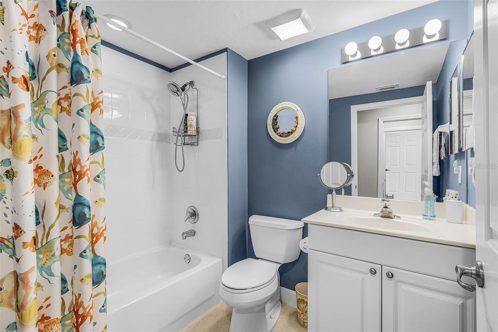 3312 Sunset Key Circle, Unit B Punta Gorda, FL 33955 - Photo 17 of 37 a bathroom with a sink a toilet and shower