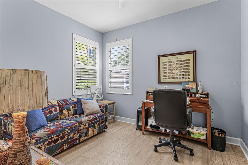 3312 Sunset Key Circle, Unit B Punta Gorda, FL 33955 - Photo 19 of 37 a livingroom with workspace and a couch