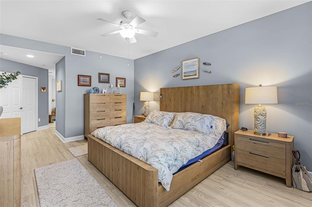 3312 Sunset Key Circle, Unit B Punta Gorda, FL 33955 - Photo 20 of 37 a bedroom with a bed and a dresser