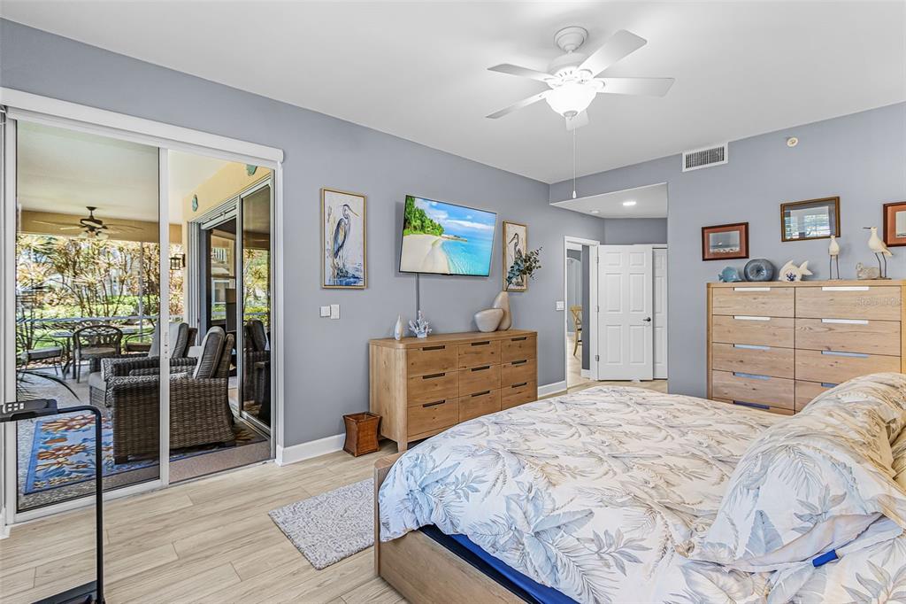 3312 Sunset Key Circle, Unit B Punta Gorda, FL 33955 - Photo 21 of 37 a bedroom with a bed and a dresser