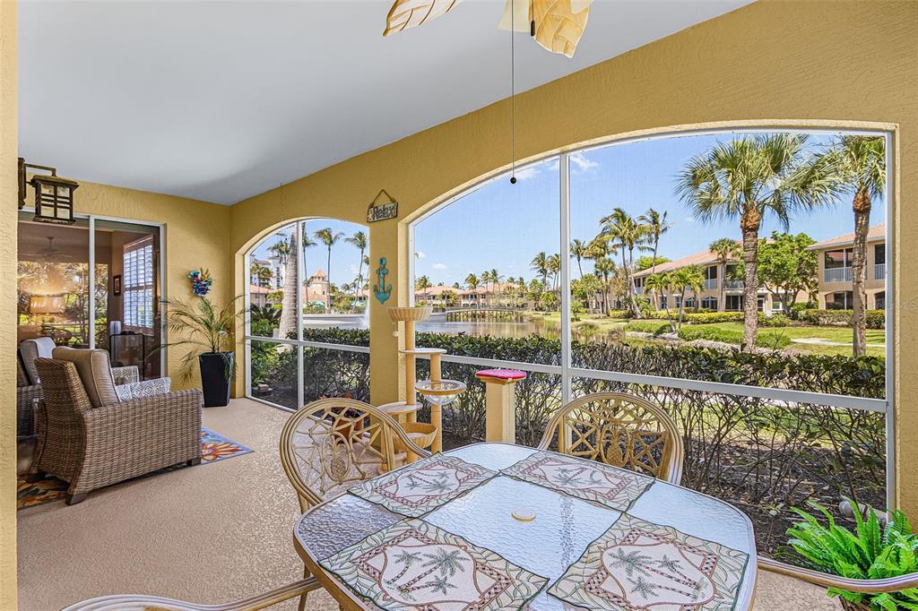 3312 Sunset Key Circle, Unit B Punta Gorda, FL 33955 - Photo 25 of 37 a living room with furniture and a floor to ceiling window