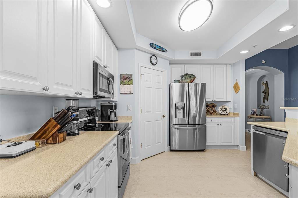 3312 Sunset Key Circle, Unit B Punta Gorda, FL 33955 - Photo 9 of 37 a kitchen with stainless steel appliances granite countertop a refrigerator and a stove