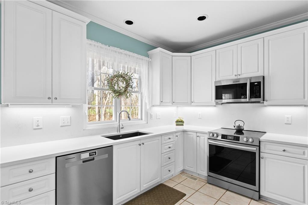 2064 Union Cross Road Winston-Salem, NC 27107 - Photo 13 of 50 At end of cabinets is a vaccum you sweep into and it sends it to the central vac