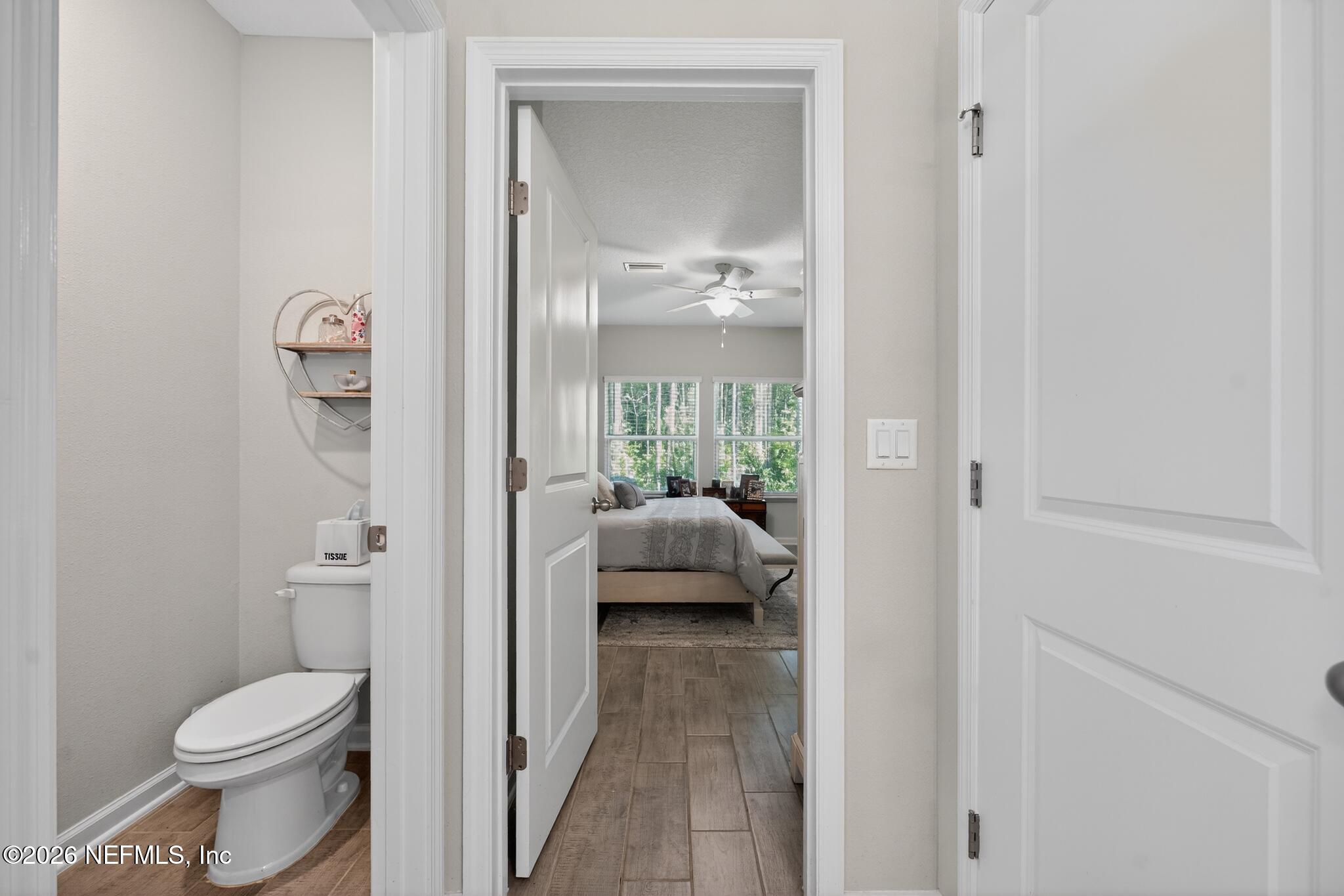 75505 Banyan Way Yulee, FL 32097 - Photo 19 of 30 a en suite bathroom with a toilet a sink and a mirror