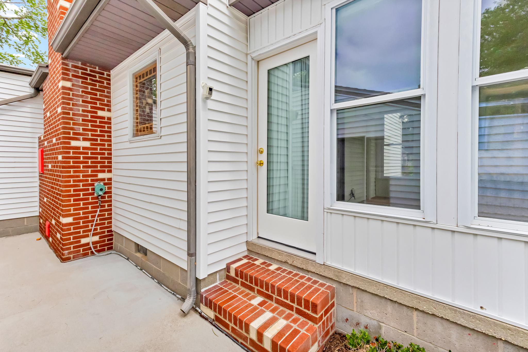 11163 Stewart Neck Road Princess Anne, MD 21853 - Photo 49 of 80 Access to the sunroom. Brick steps and fireplace.