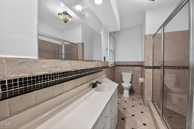 a living room with hard wood floors and a window