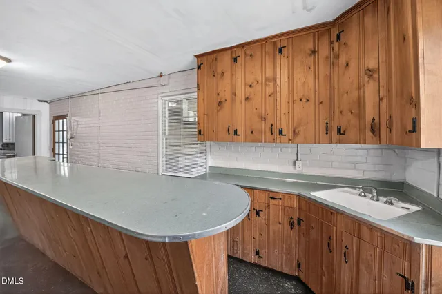 a bedroom with furniture and large windows