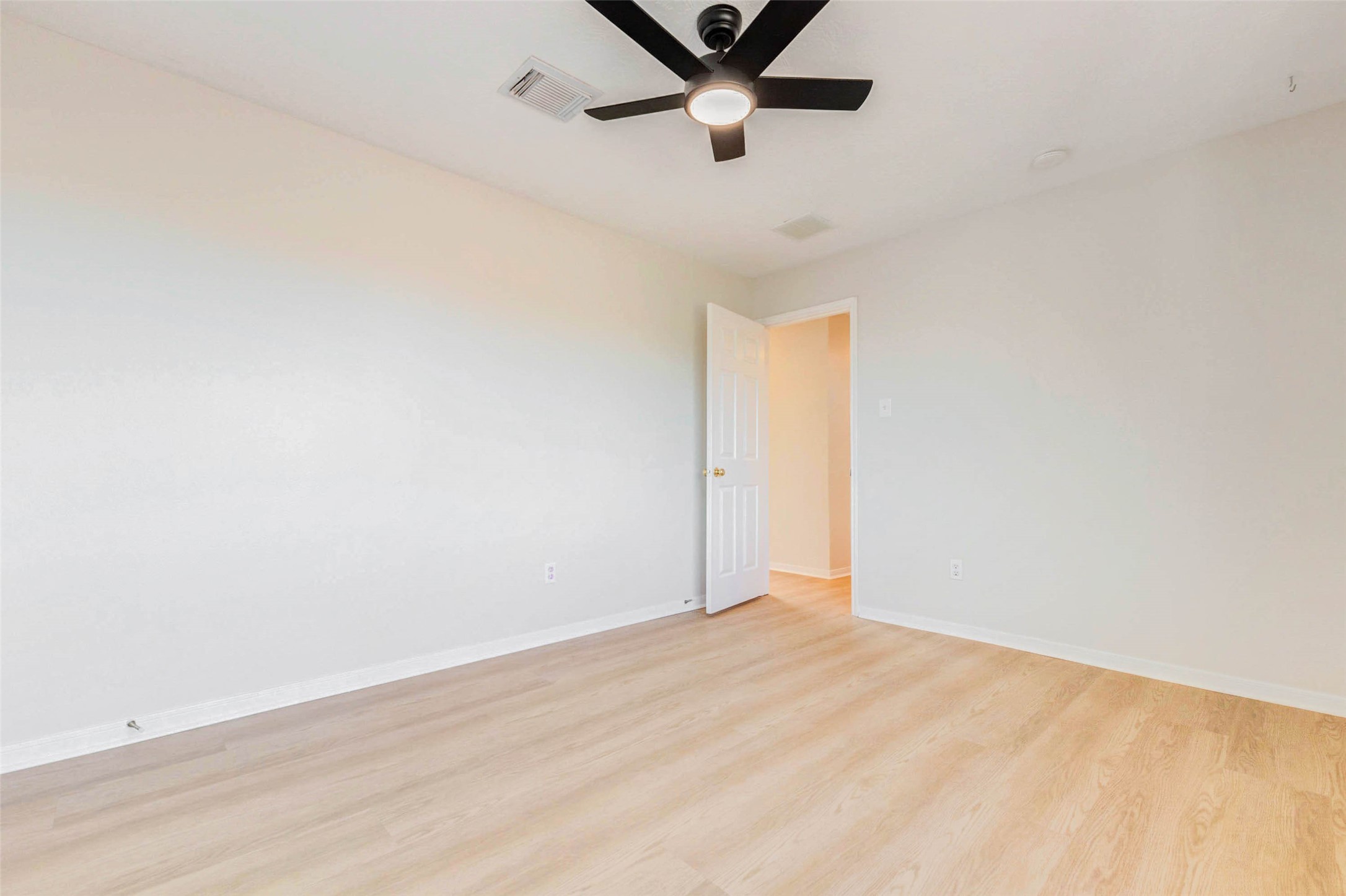 5318 Cilantro Lane Baytown, TX 77521 - Photo 36 of 45 a view of a room with wooden floor