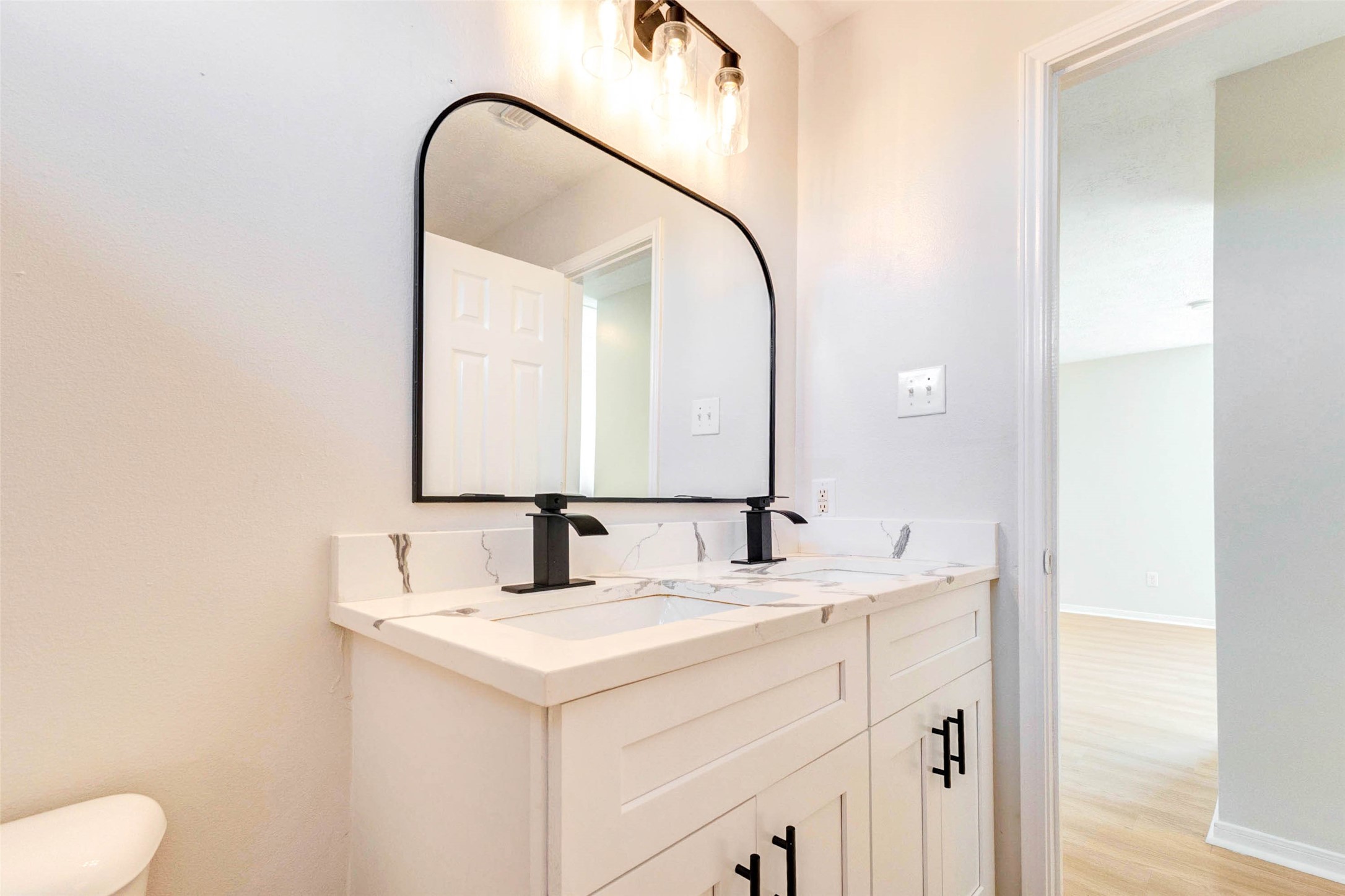 5318 Cilantro Lane Baytown, TX 77521 - Photo 39 of 45 a bathroom with a sink and a mirror
