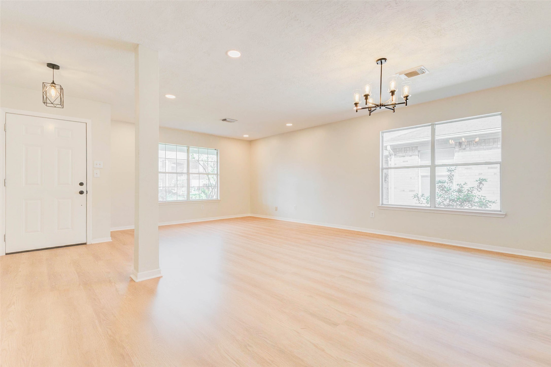 5318 Cilantro Lane Baytown, TX 77521 - Photo 7 of 45 an empty room with windows and ceiling fan
