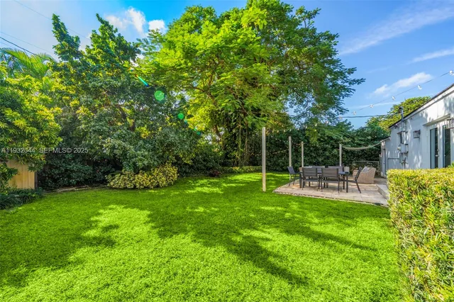 a view of a chair and table of the garden