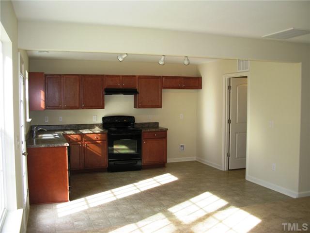 1639 Moineau Lane Raleigh, NC 27610 - Photo 16 of 17 colors and details could vary. Picture demonstrates standard cabinets, knobs and appliances, cabinet above refrigerator space is not included