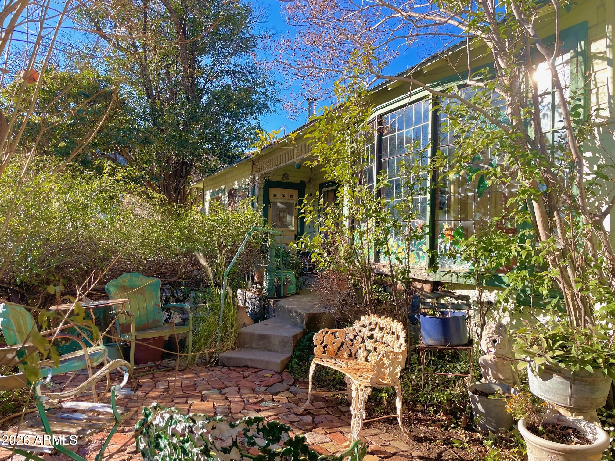 132 Opera Drive Bisbee, AZ 85603 - Photo 12 of 62 a front view of a house with a yard