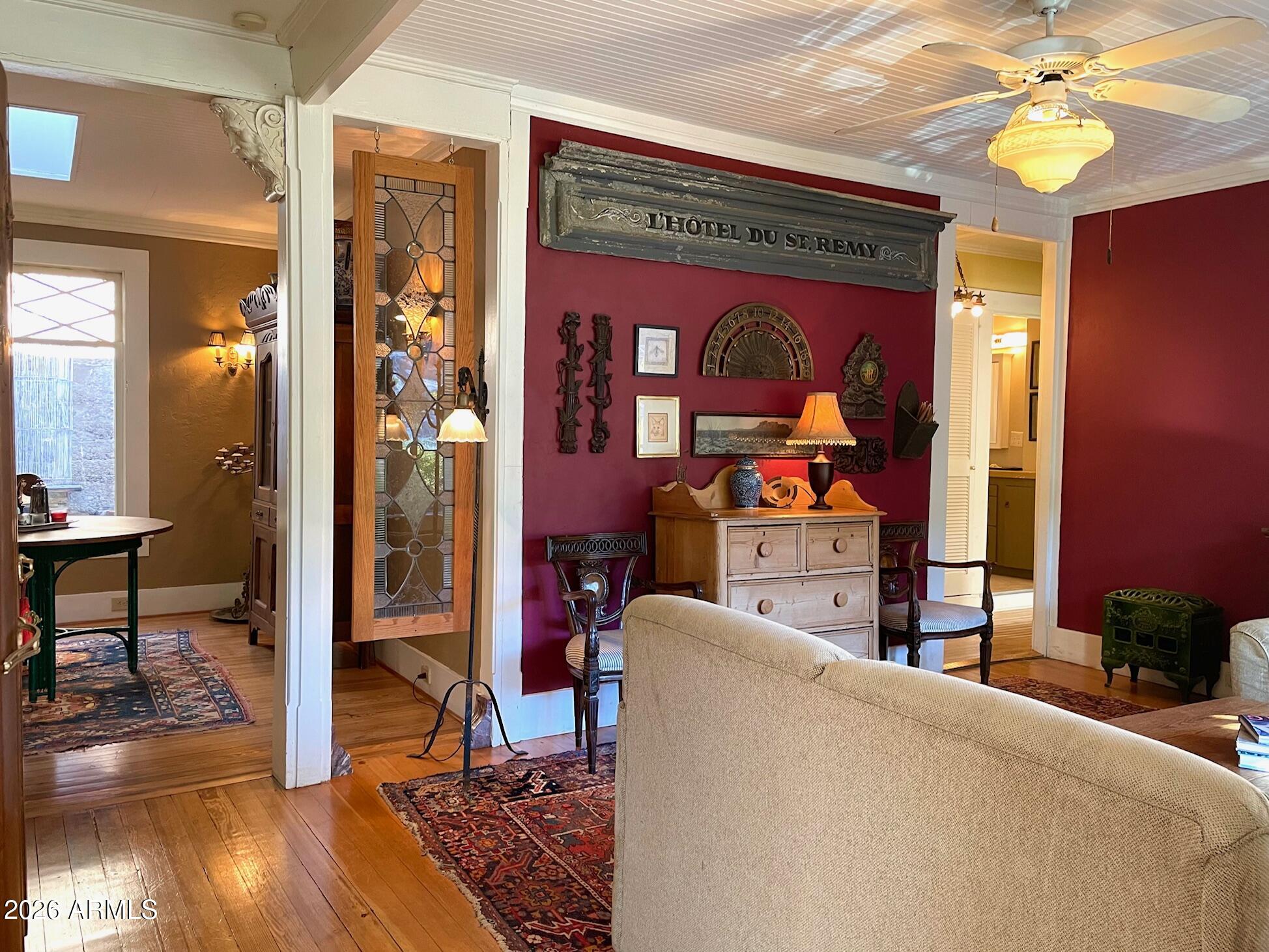 132 Opera Drive Bisbee, AZ 85603 - Photo 21 of 62 a living room filled with furniture and a chandelier