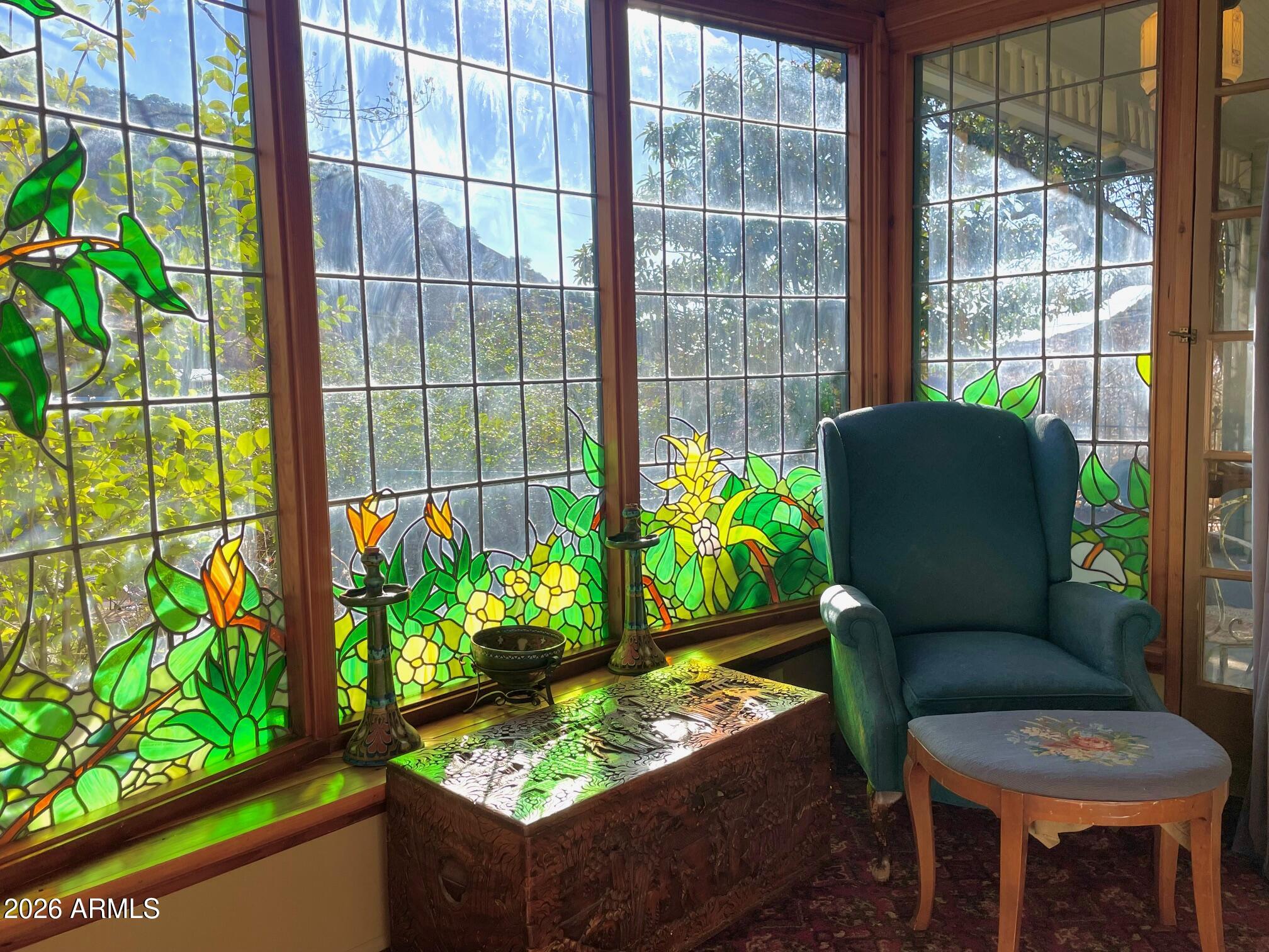 132 Opera Drive Bisbee, AZ 85603 - Photo 34 of 62 a living room filled with furniture and a potted plant