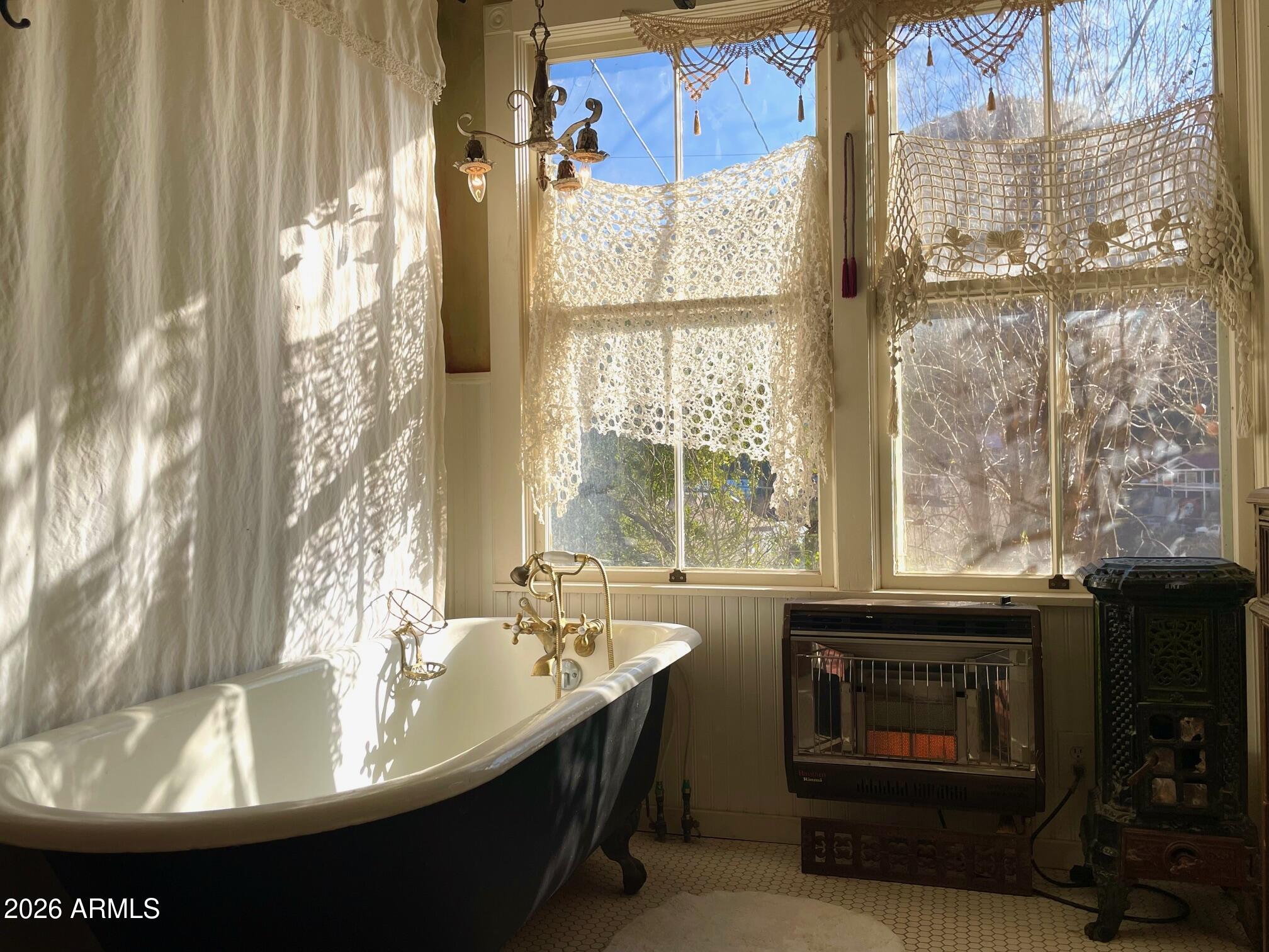 132 Opera Drive Bisbee, AZ 85603 - Photo 37 of 62 a room with a fireplace and windows