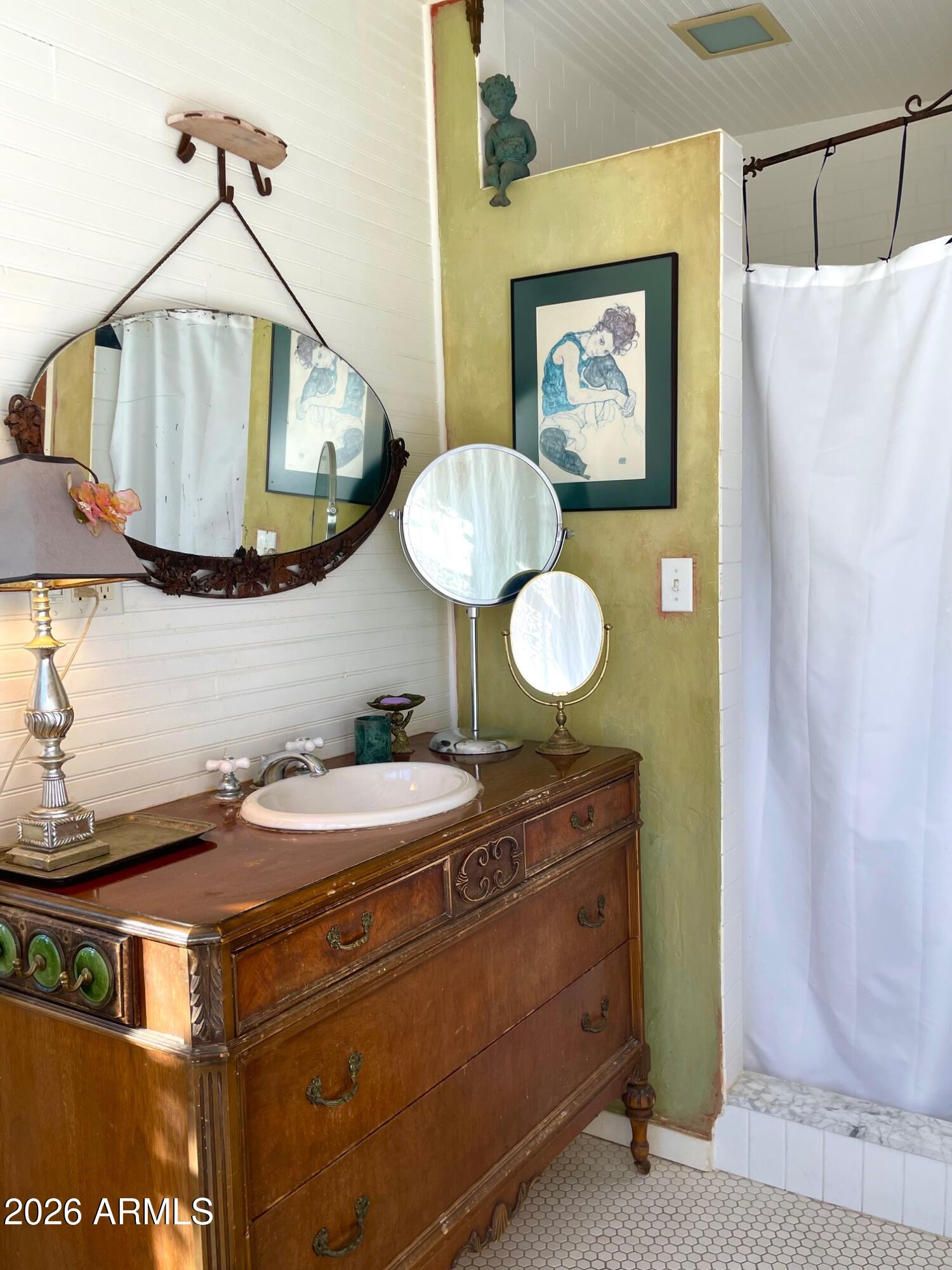 132 Opera Drive Bisbee, AZ 85603 - Photo 38 of 62 a bathroom with a sink and a mirror