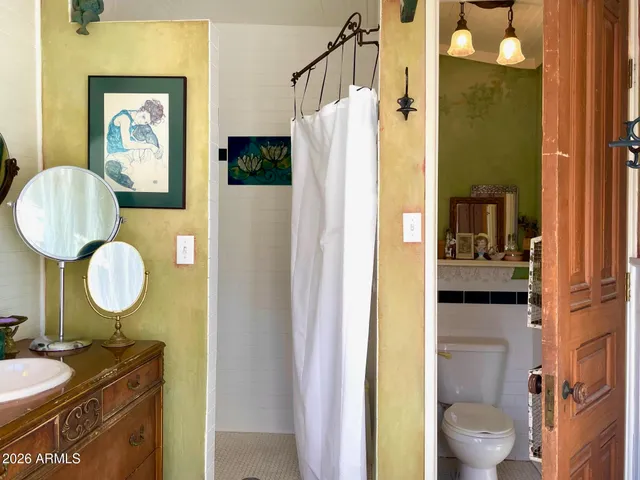 a view of an empty room with a fireplace and a large window