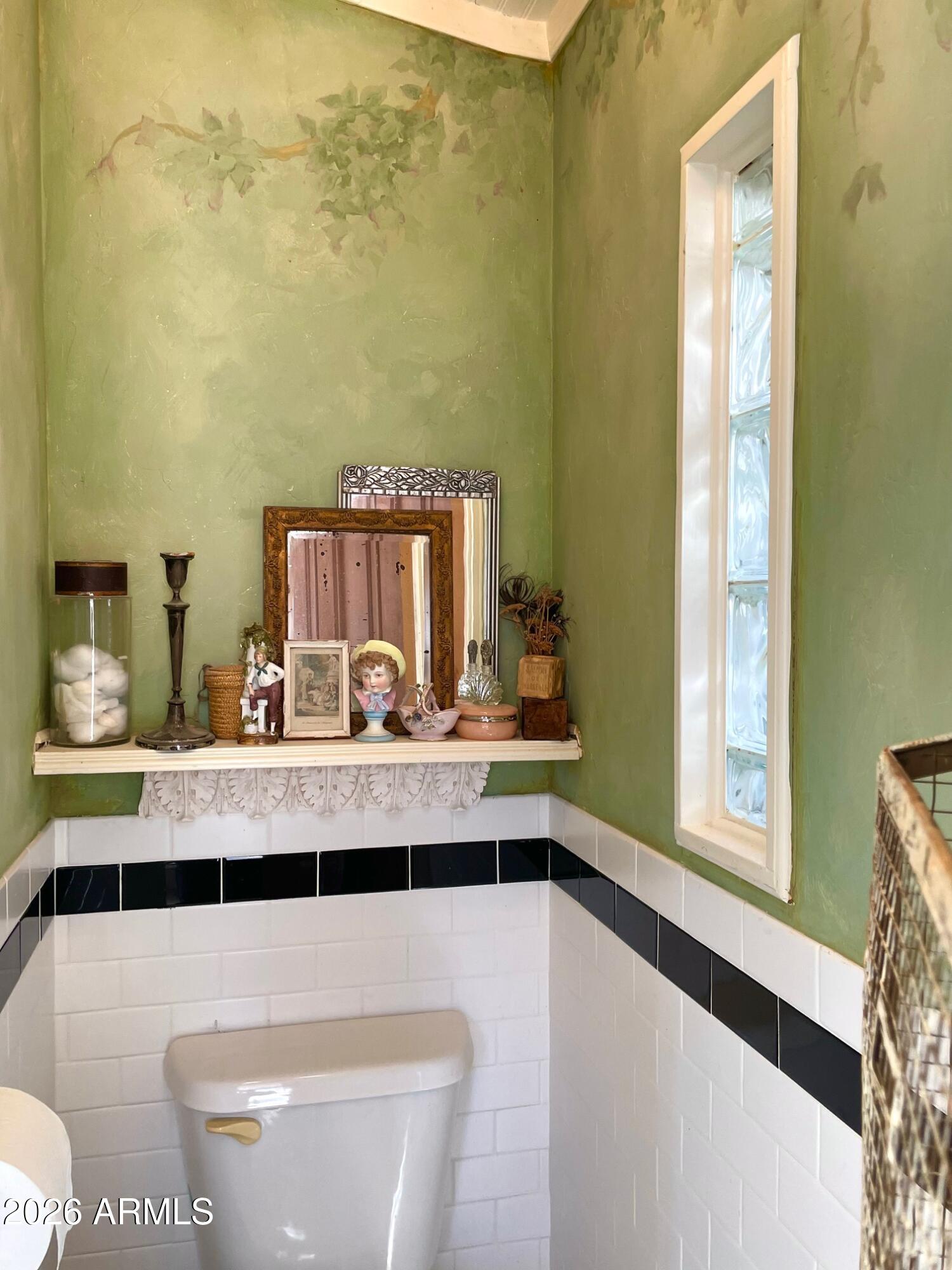 132 Opera Drive Bisbee, AZ 85603 - Photo 40 of 62 a bathroom with a sink a toilet and a mirror