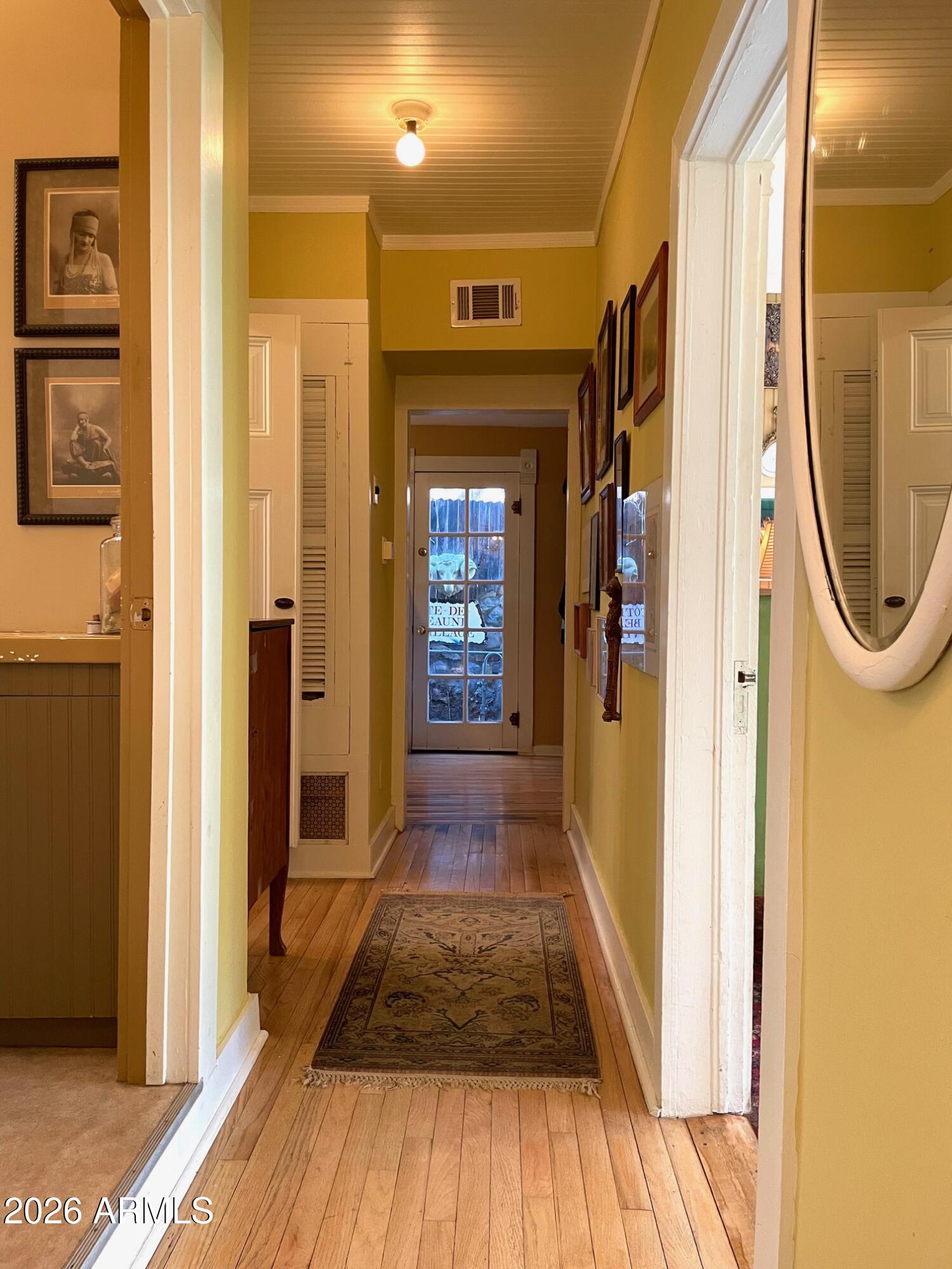 132 Opera Drive Bisbee, AZ 85603 - Photo 41 of 62 a view of a hallway with wooden floor