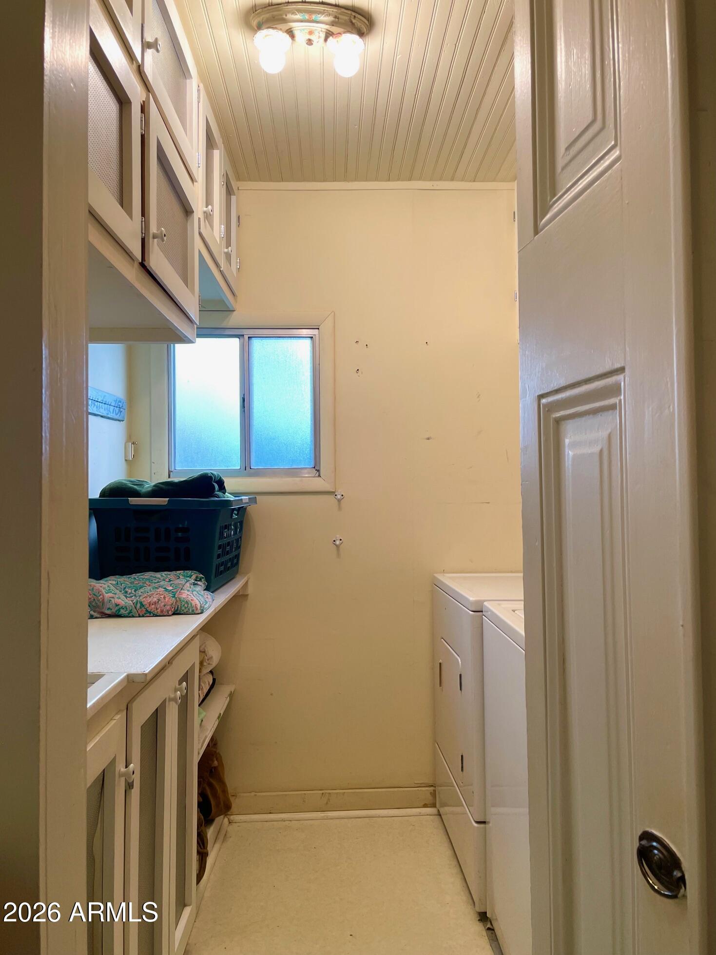 132 Opera Drive Bisbee, AZ 85603 - Photo 45 of 62 a utility room with a sink a washer and dryer
