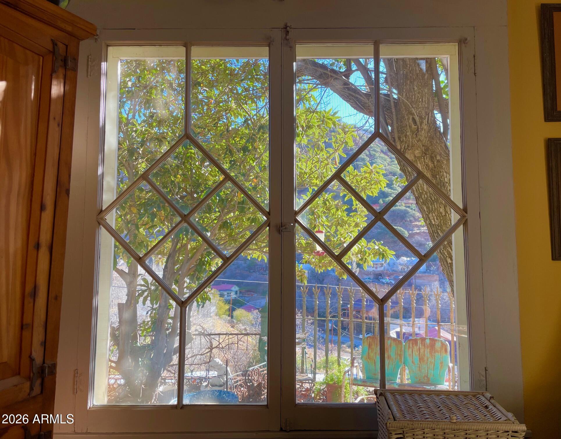 132 Opera Drive Bisbee, AZ 85603 - Photo 48 of 62 a view of a brick house with a large windows