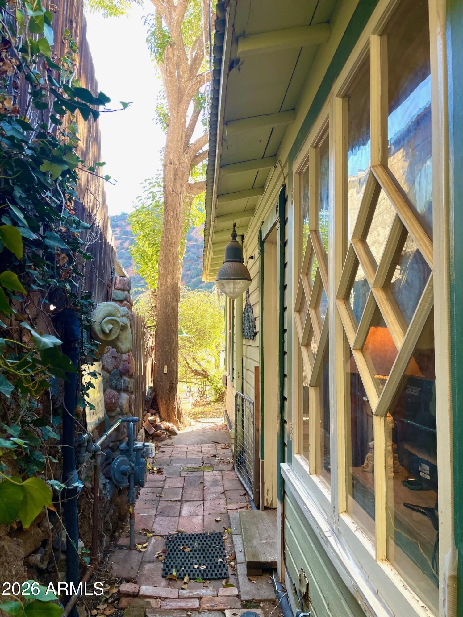 132 Opera Drive Bisbee, AZ 85603 - Photo 55 of 62 a front view of a house with a garden