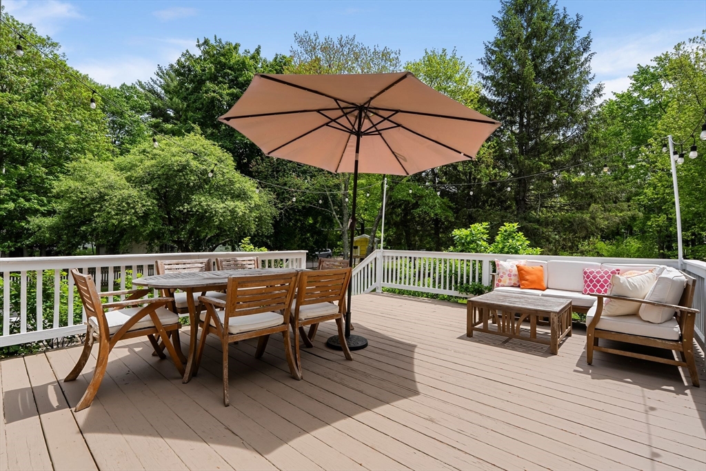 35 Spallus Road Stoughton, MA 02072 - Photo 34 of 39 an outdoor sitting area with furniture and wooden deck