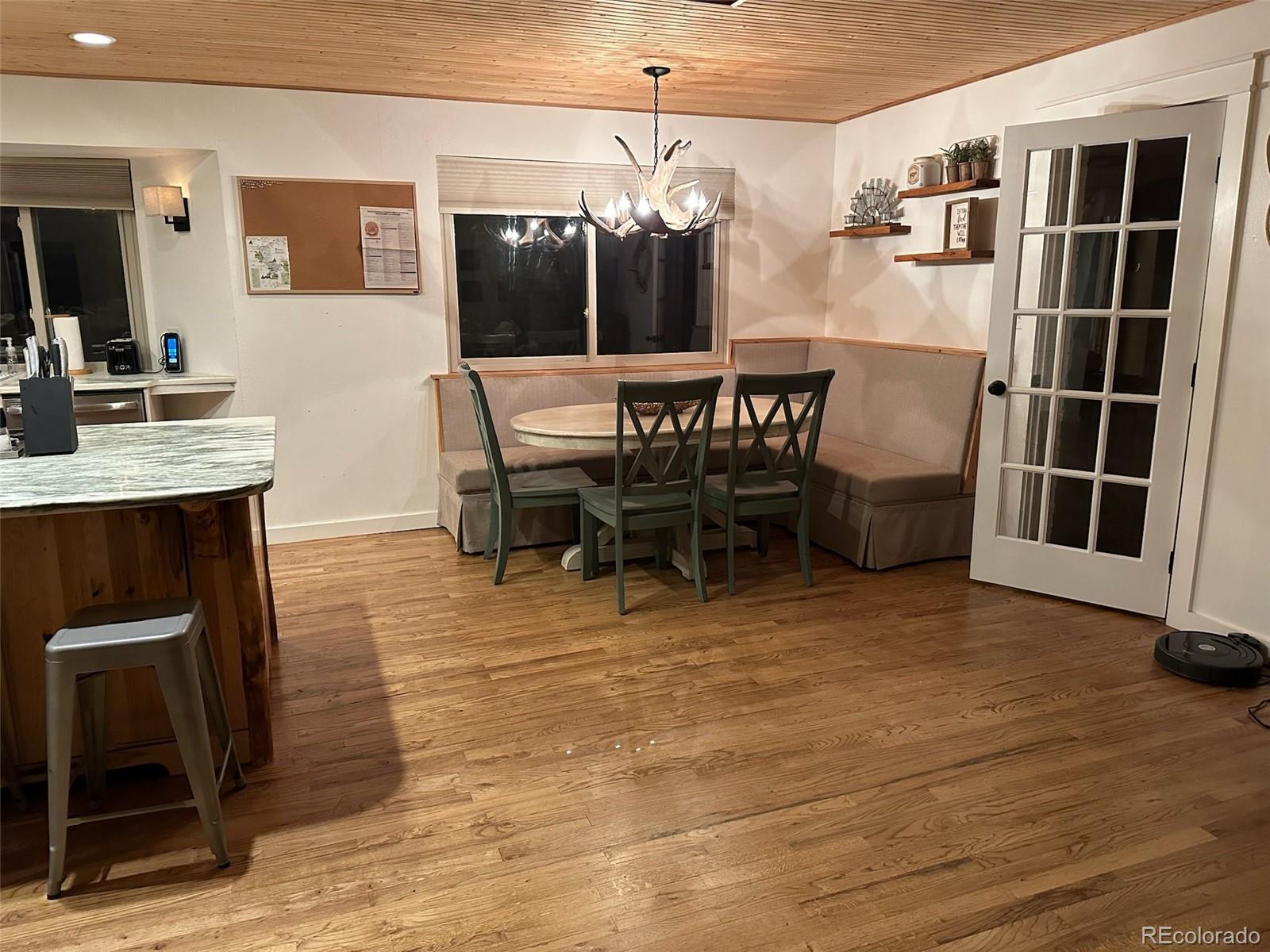 974 Wagon Trail Road Evergreen, CO 80439 - Photo 11 of 45 a dining room with furniture and window