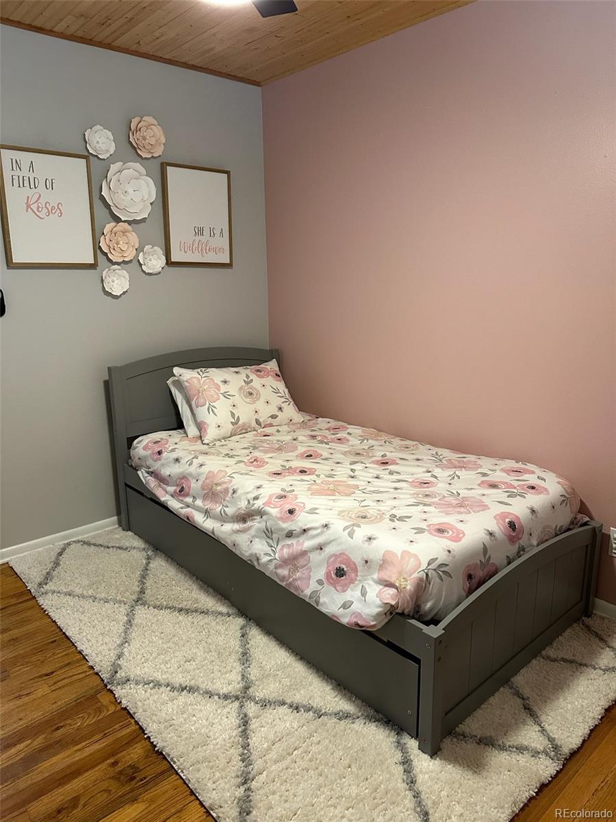 974 Wagon Trail Road Evergreen, CO 80439 - Photo 23 of 45 a bedroom with bed and cupboard