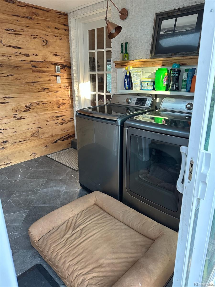 974 Wagon Trail Road Evergreen, CO 80439 - Photo 31 of 45 a bedroom with a bed and a dresser