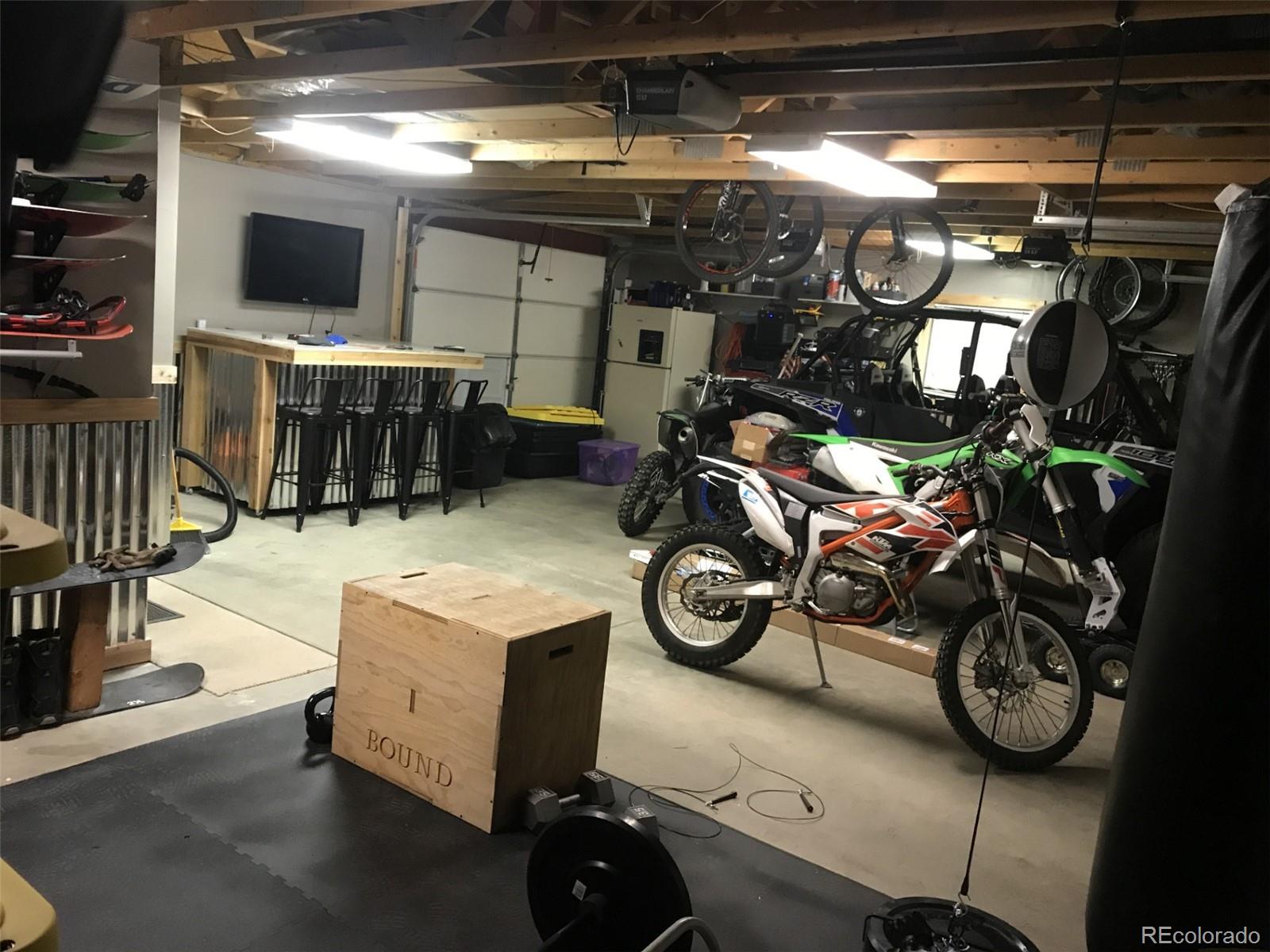 974 Wagon Trail Road Evergreen, CO 80439 - Photo 32 of 45 a view of a room with gym equipment