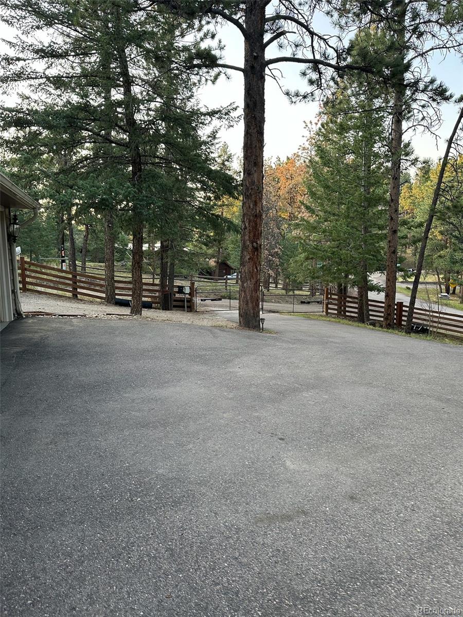 974 Wagon Trail Road Evergreen, CO 80439 - Photo 37 of 45 a view of a road with trees