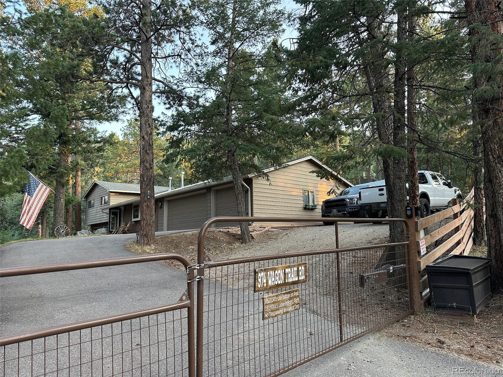 974 Wagon Trail Road Evergreen, CO 80439 - Photo 43 of 45 a house view with a outdoor space