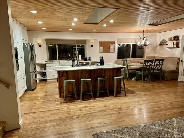 a dining room with furniture and window