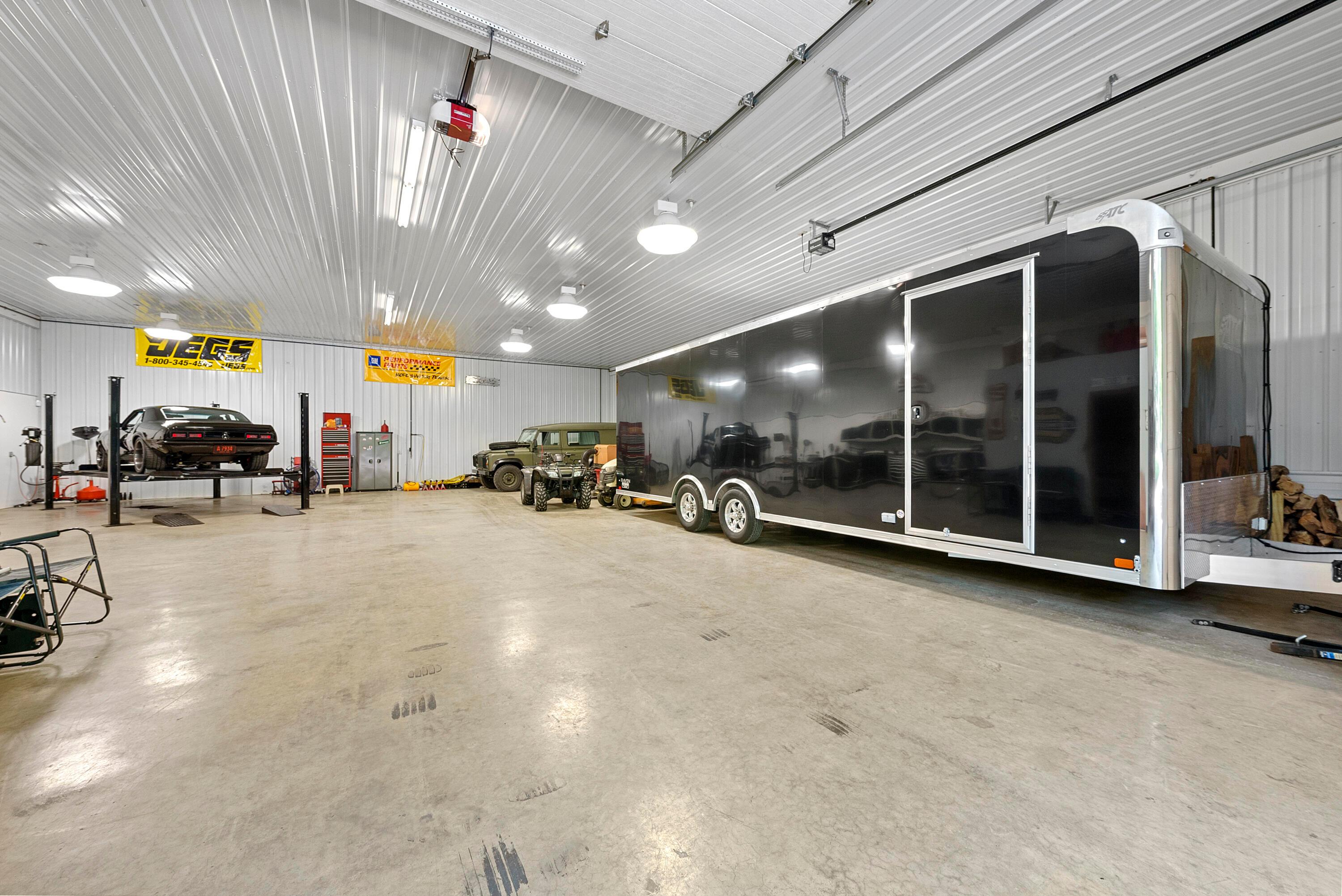 5761 Hughes Road Galena, OH 43021 - Photo 37 of 43 The building features a concrete floor/pad with radiant heating, electric service with Generac generator backup, extensive, bright ceiling lighting, water service, and a four post Car Lift.