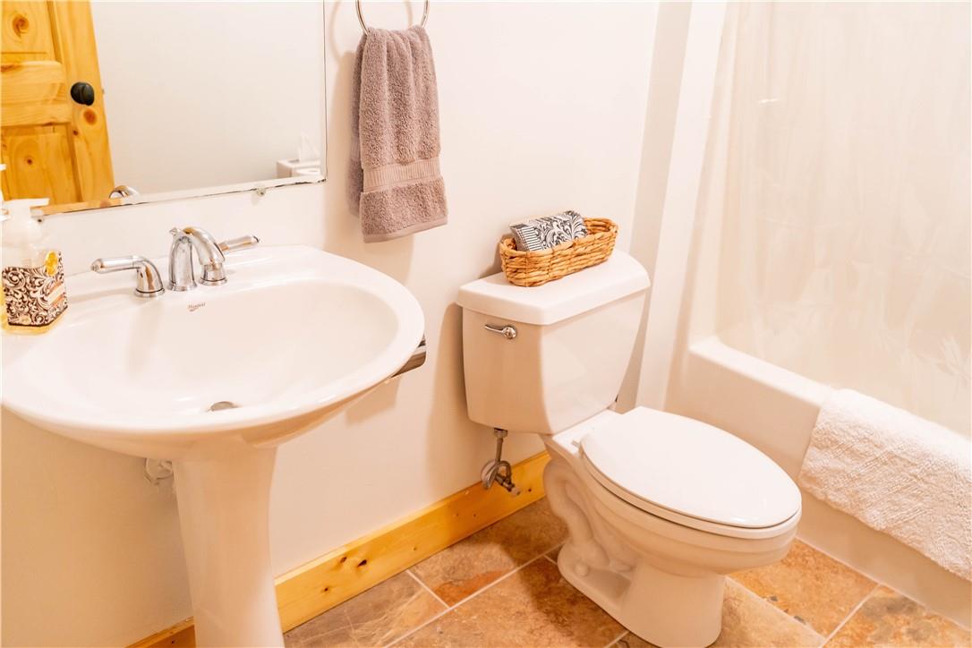 514 Boone Ridge Lane Boone, NC 28607 - Photo 28 of 42 a bathroom with a toilet sink and mirror