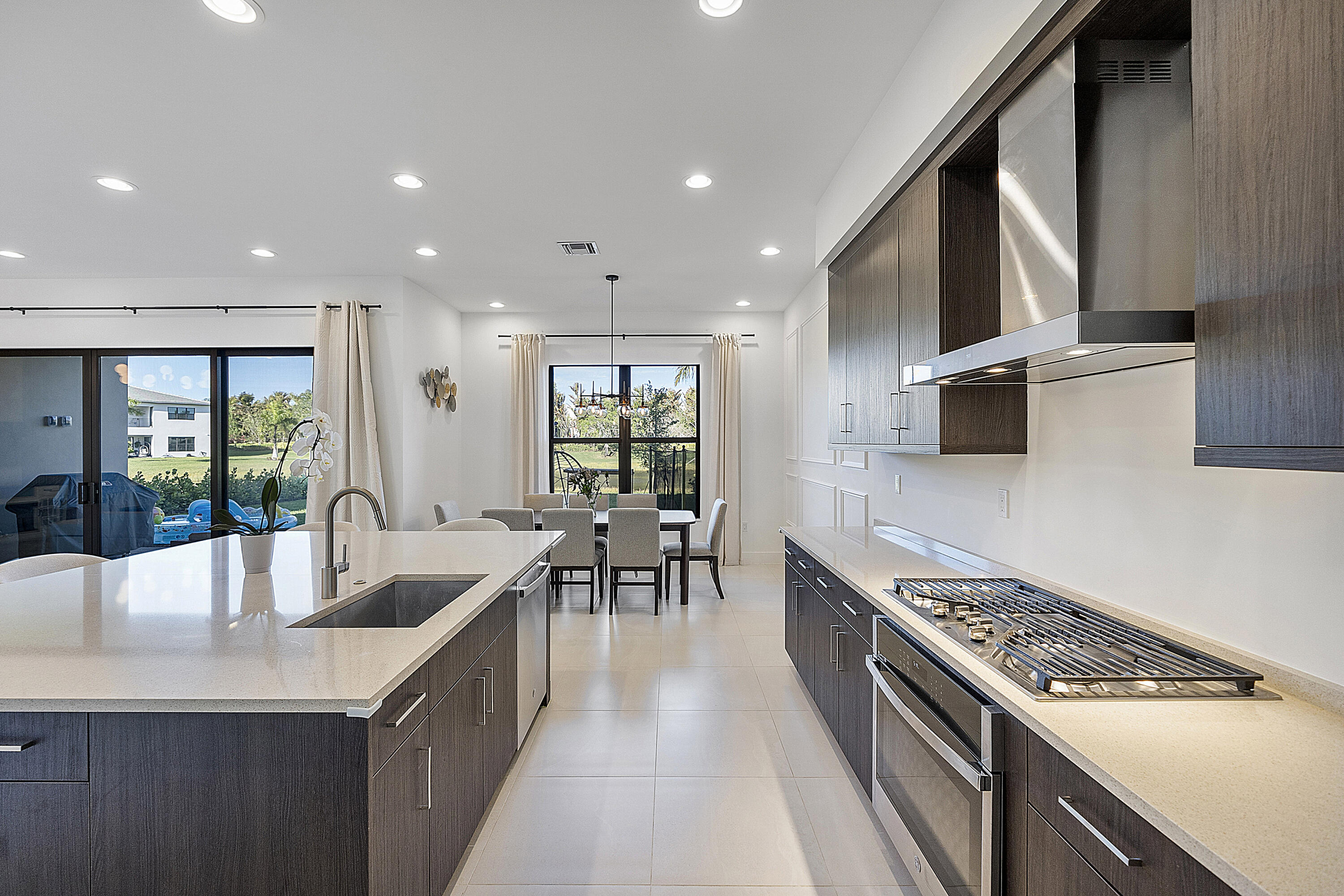 20296 Somerset Hls Drive Boca Raton, FL 33434 - Photo 19 of 67 a kitchen with stainless steel appliances granite countertop a sink stove and refrigerator