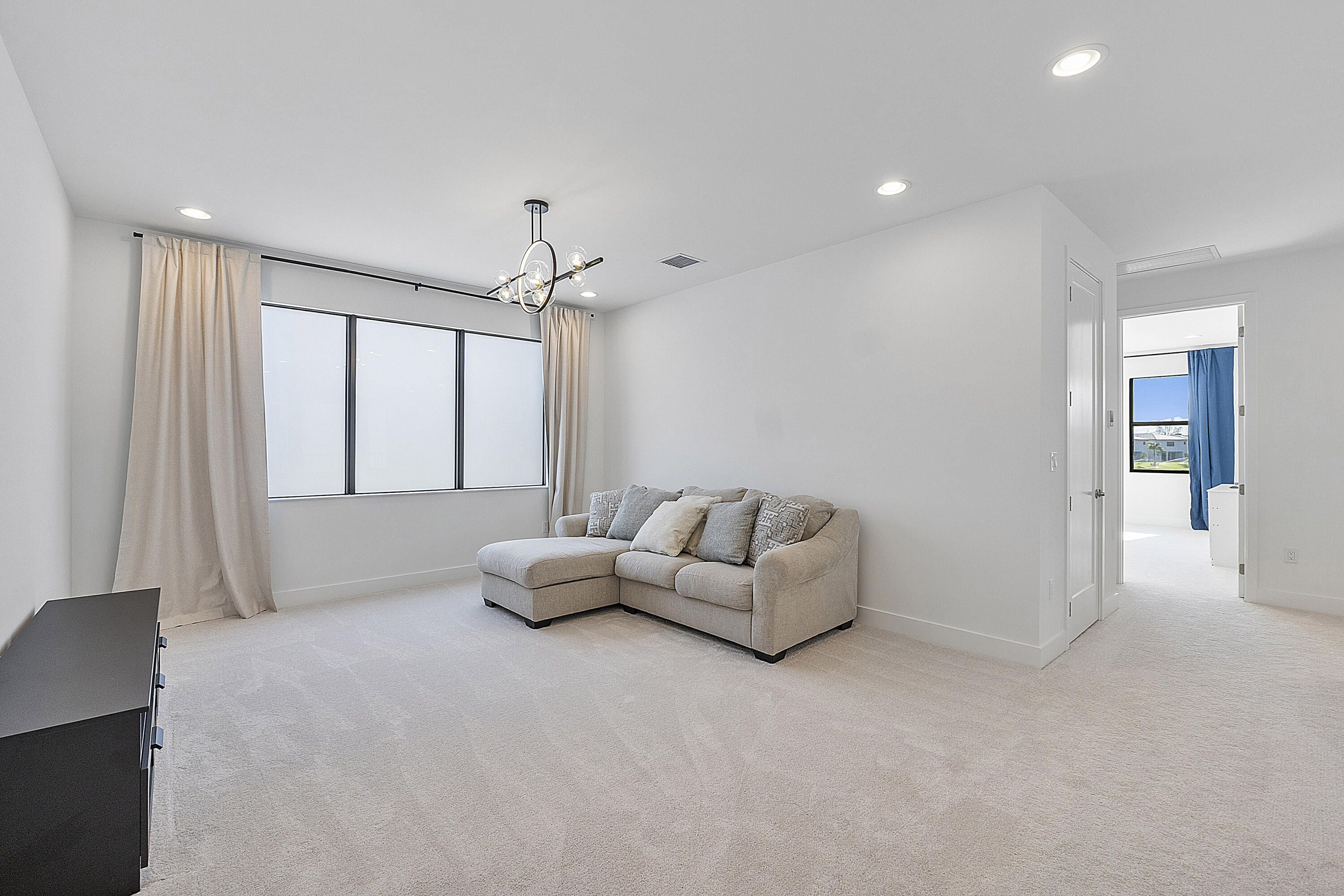 20296 Somerset Hls Drive Boca Raton, FL 33434 - Photo 24 of 67 a living room with furniture and a chandelier