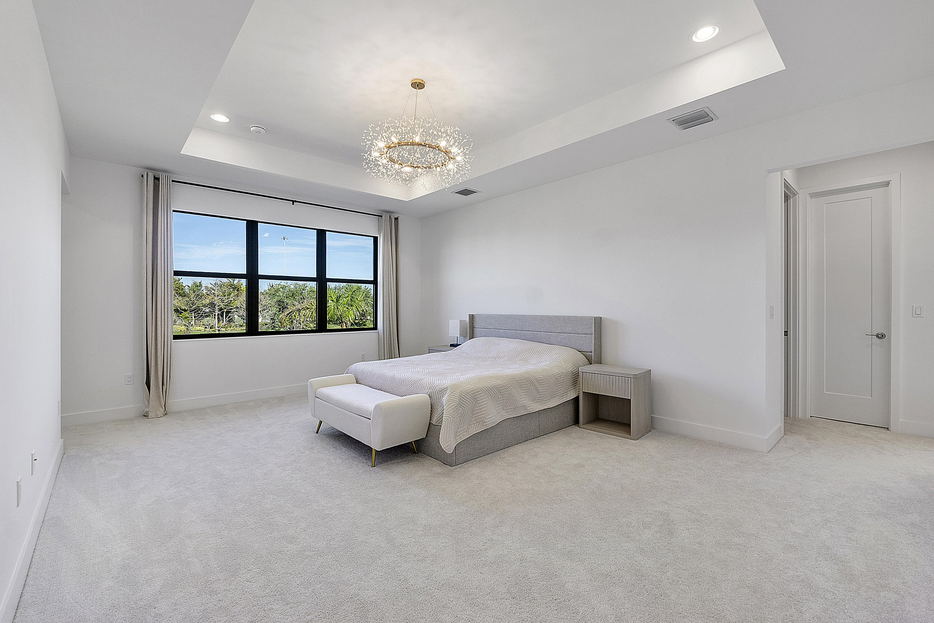 20296 Somerset Hls Drive Boca Raton, FL 33434 - Photo 25 of 67 a spacious bedroom with a bed and a large window