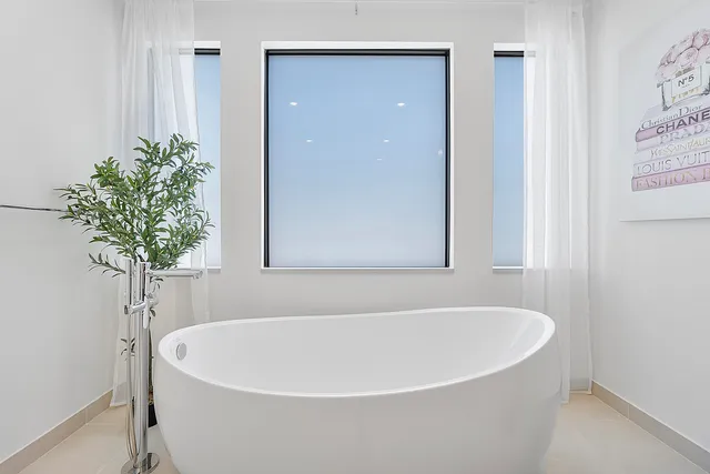 a view of a bathroom with a toilet sink and a mirror