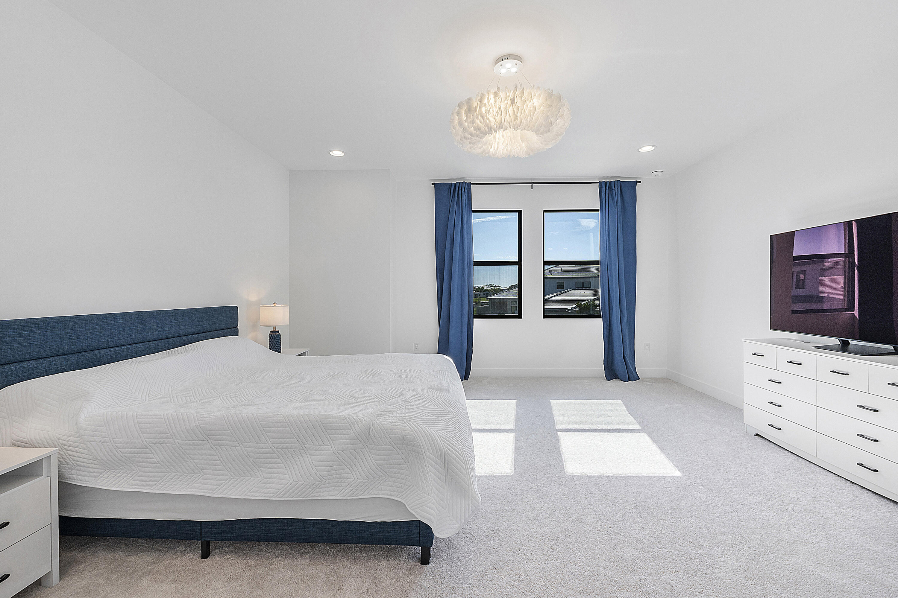 20296 Somerset Hls Drive Boca Raton, FL 33434 - Photo 35 of 67 a bedroom with a large bed and chandelier